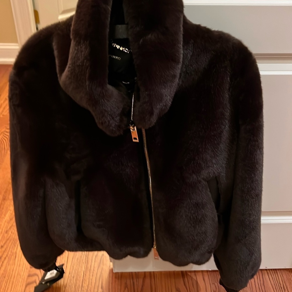 Pinko bomber coat has pull strings on the bottom to make it tight